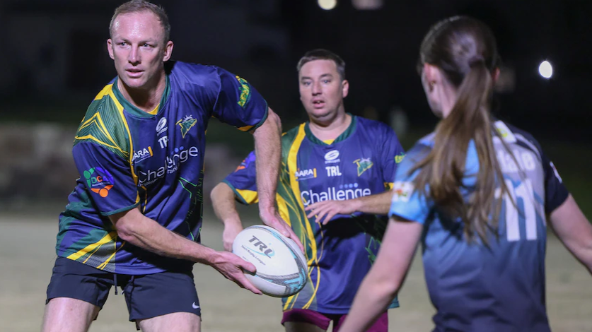 Darren Lockyer cops a sledging when he plays with Ipswich touch rugby league team ALARA Jets